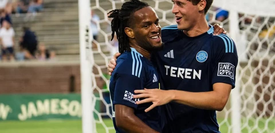 Players celebrating a goal during match