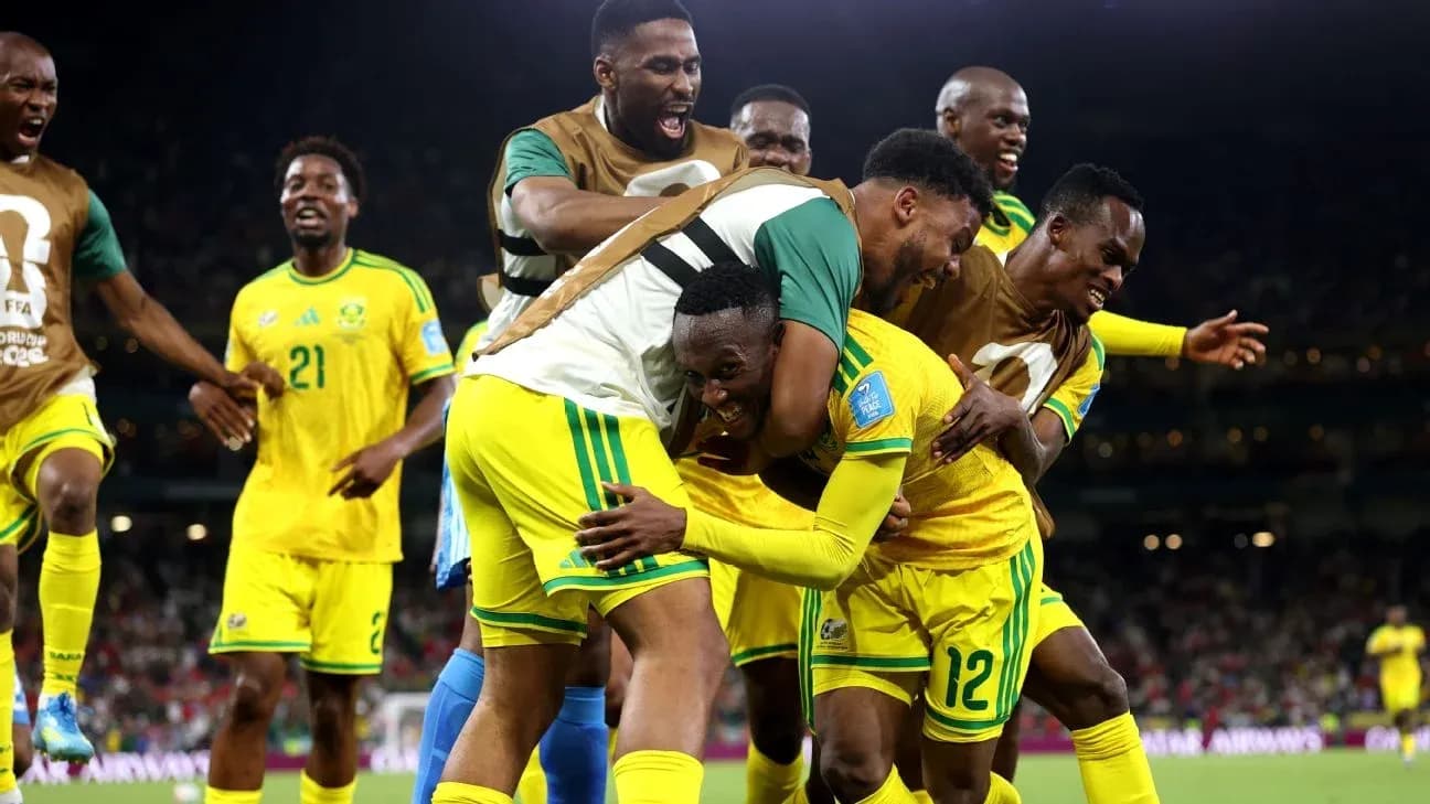 Players celebrating a goal on the field