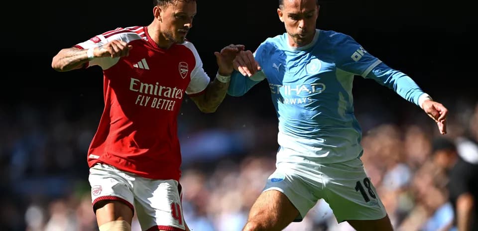 Two players battling for possession during match
