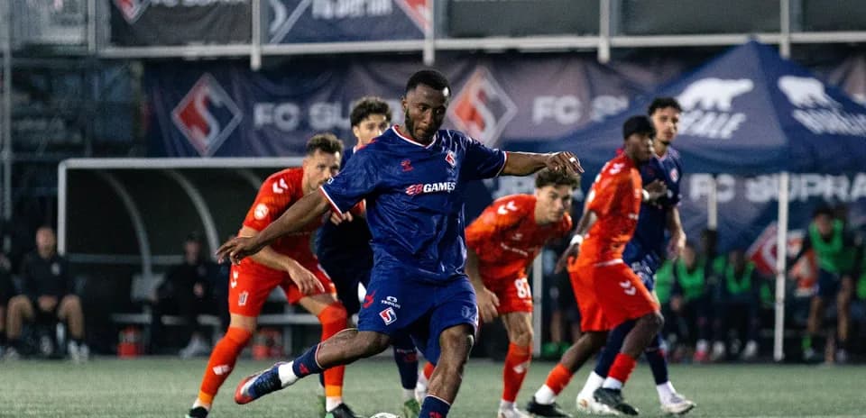 Player kicking ball during FC Supra match
