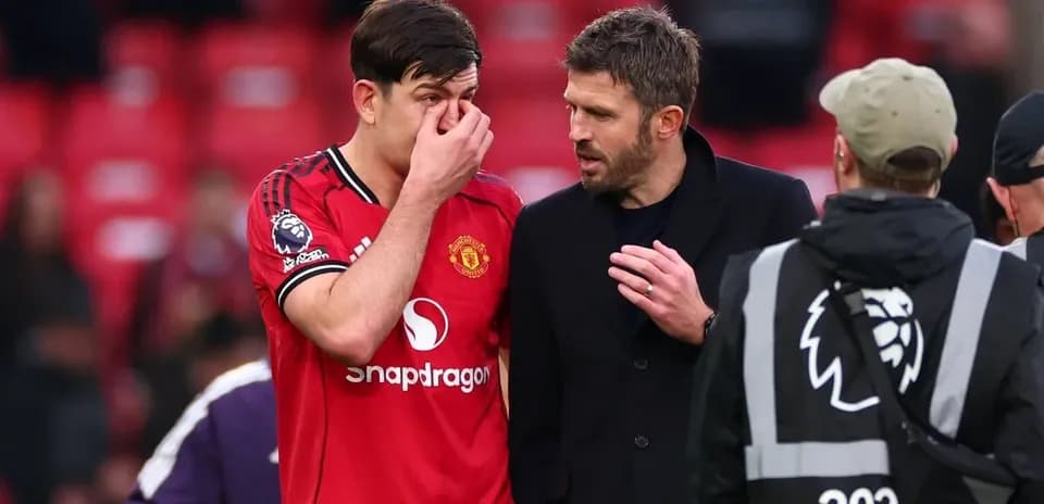 Harry Maguire talking to Michael Carrick after match