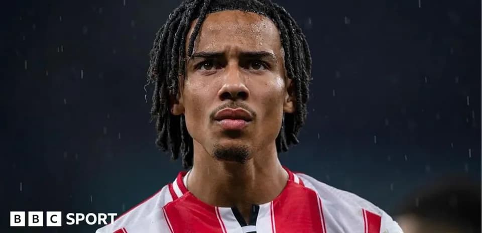 Brentford player looking focused in rainy conditions