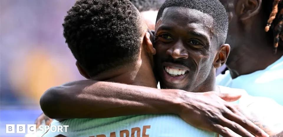 Players embracing after scoring a goal