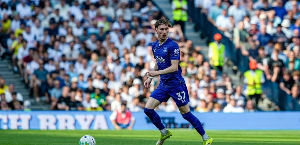 Player in blue jersey dribbling during match