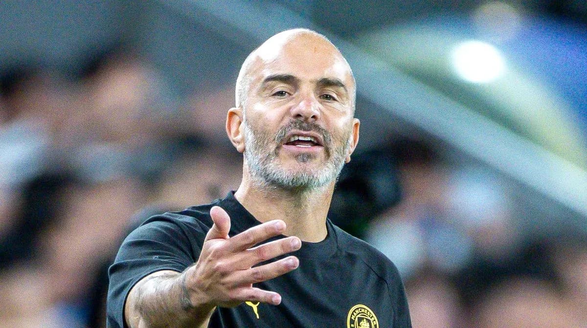 Coach gesturing during a football match