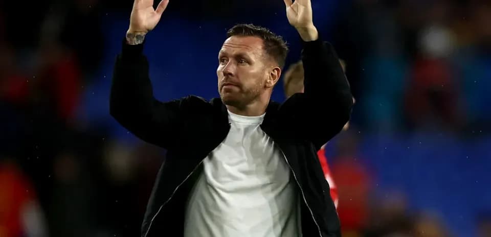 Man waving to fans after a match