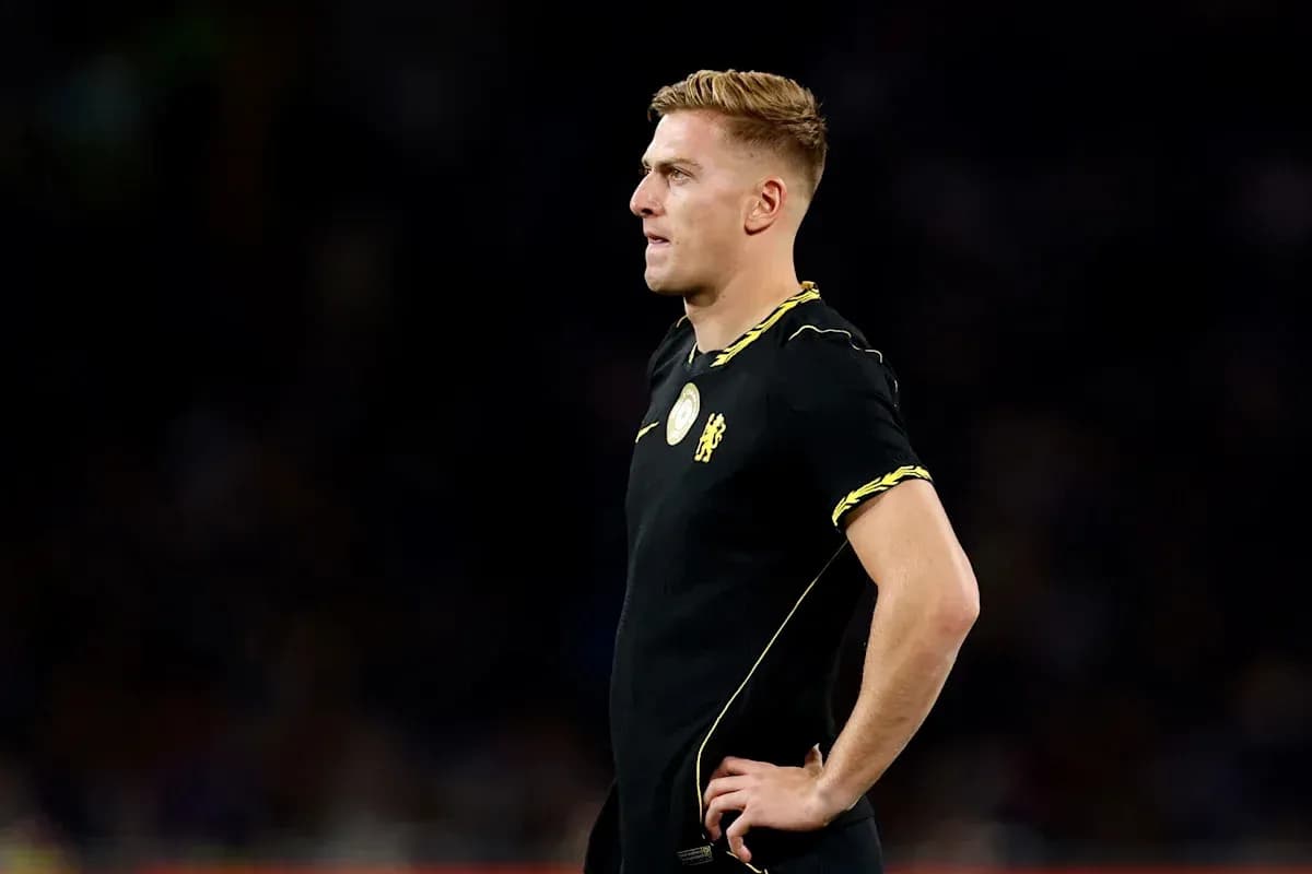 Player in black jersey standing on the field