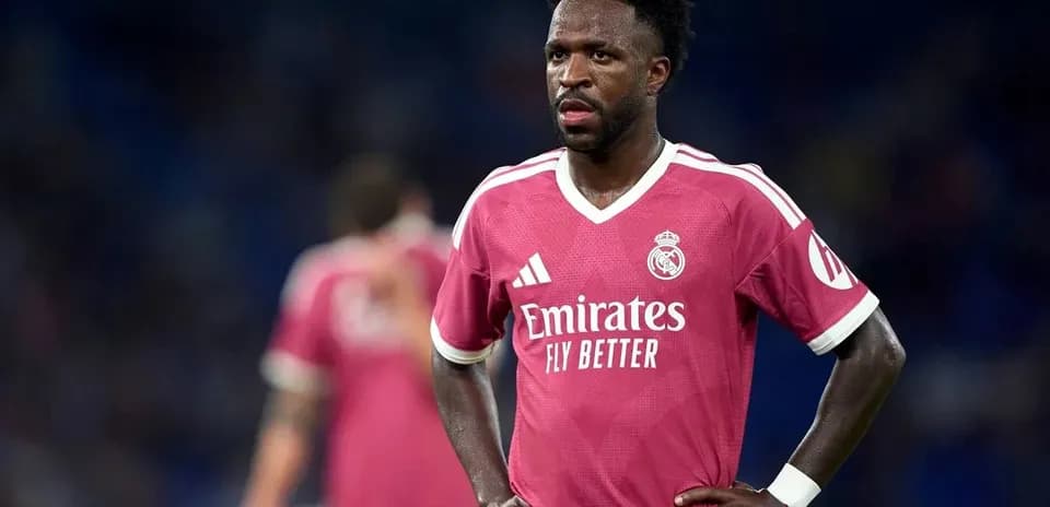 Player in pink Real Madrid kit on field