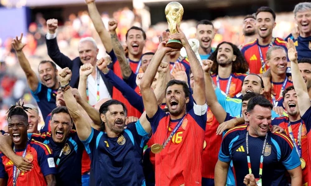 Spain team celebrating victory with World Cup trophy