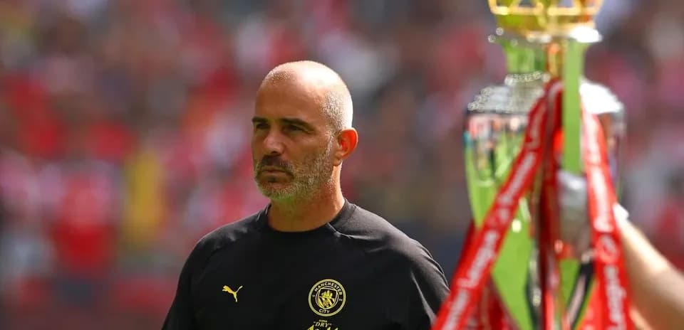 Manager observing trophy presentation at the stadium