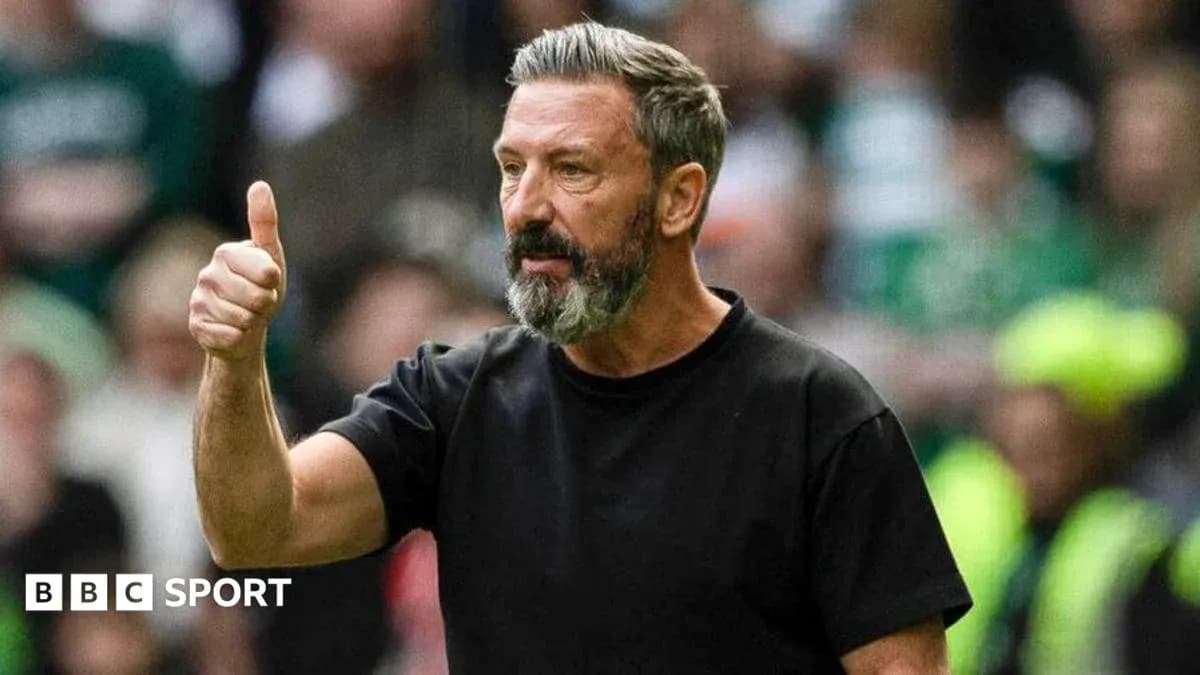 Manager giving thumbs up during match action
