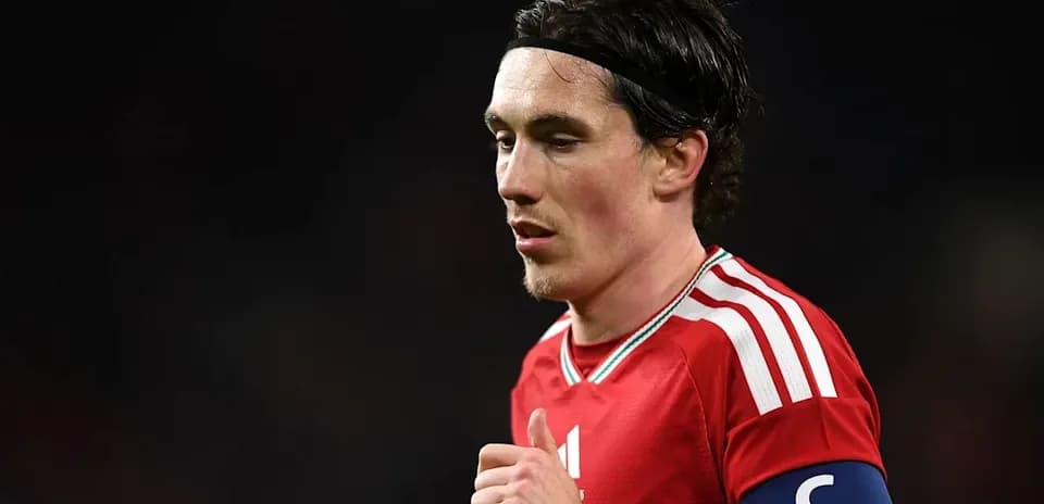 Player in red jersey with captain's armband