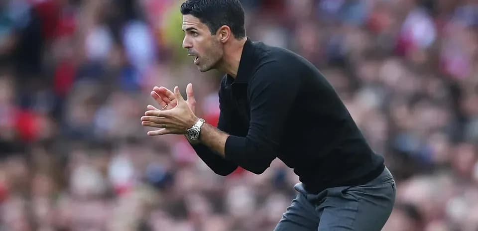 Manager instructing players from the sidelines during match