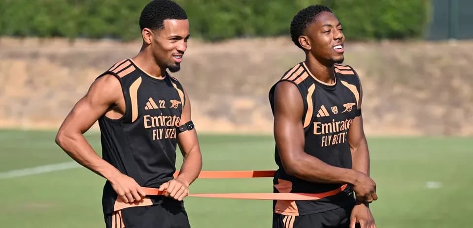 Two players stretching with resistance bands during training