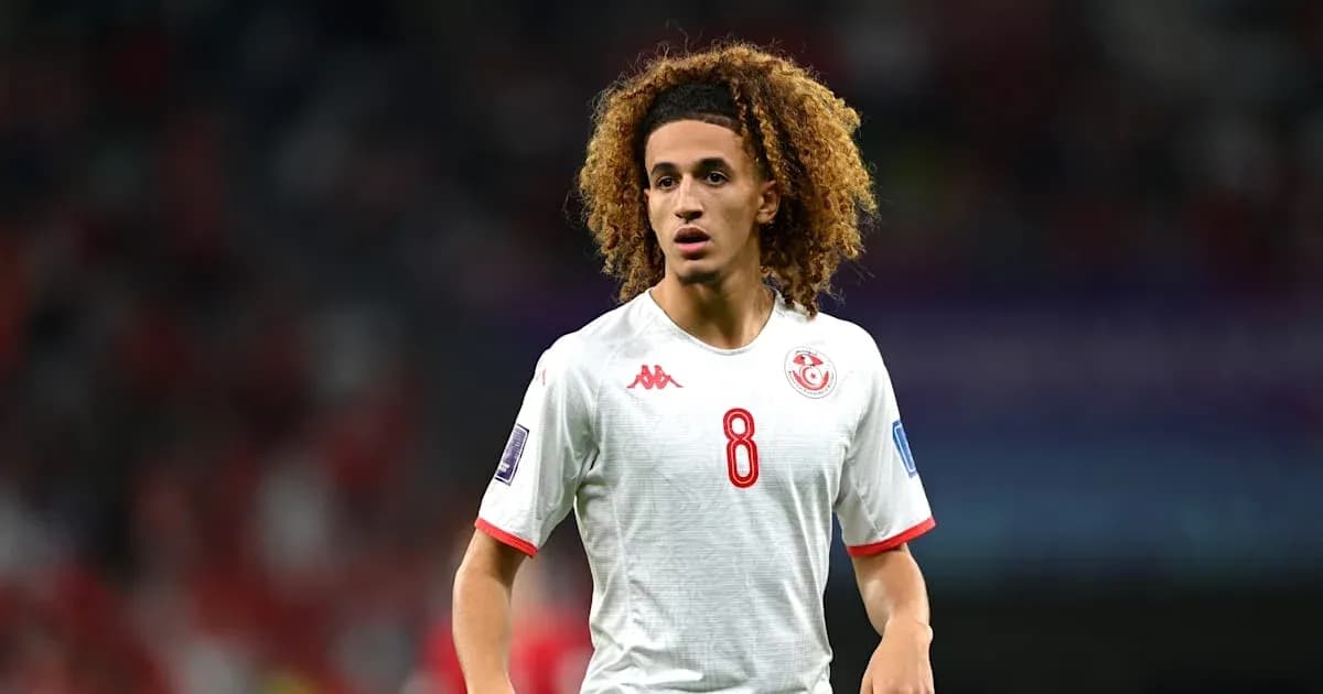 Player wearing Tunisia jersey during match on field