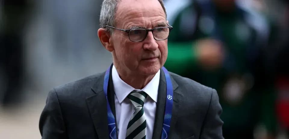 Man in suit arriving at UEFA match venue