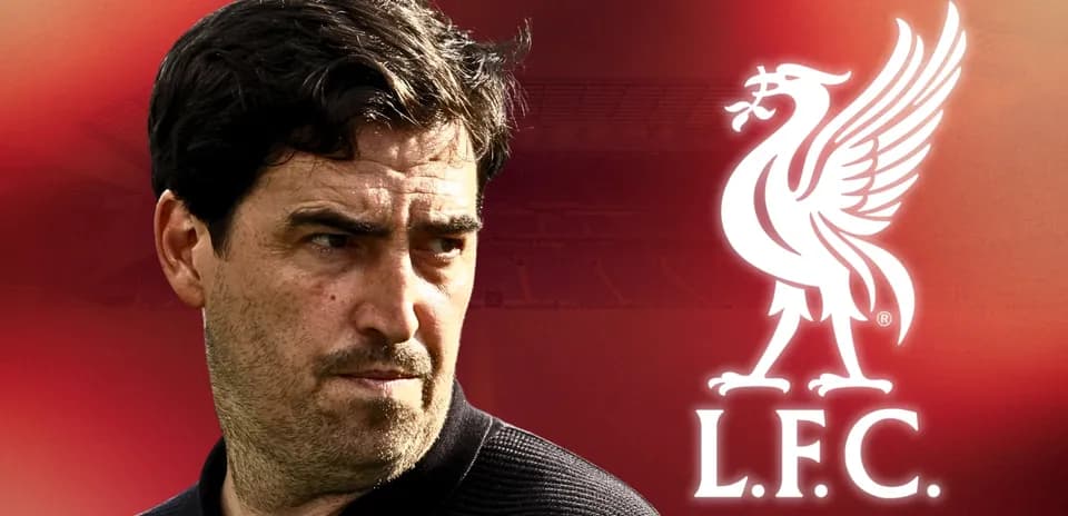 Coach portrait with Liverpool FC logo in background