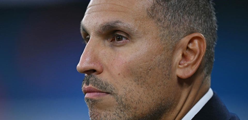 Close-up of a man in profile looking serious