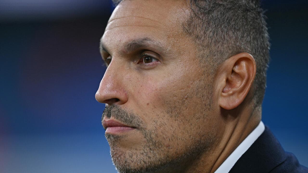 Close-up of a man in profile looking serious