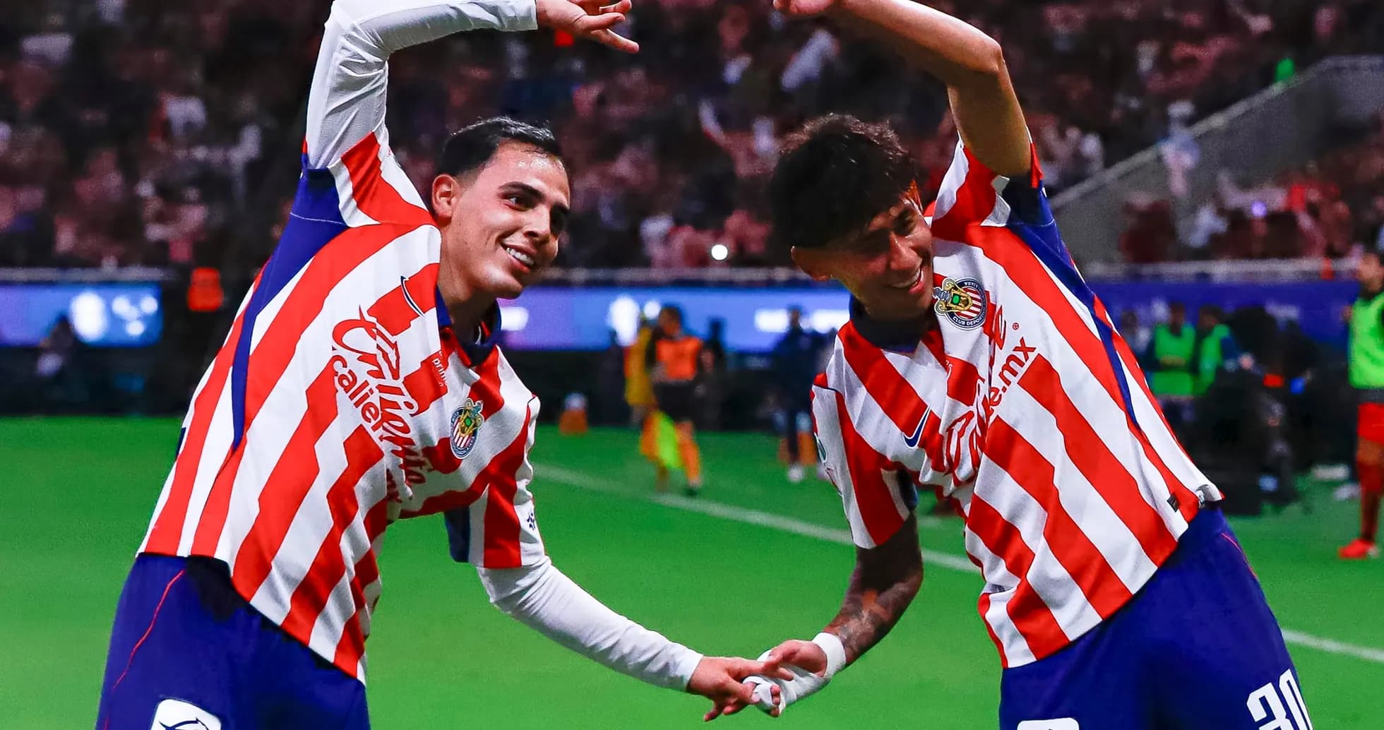 Chivas players celebrating after scoring a goal