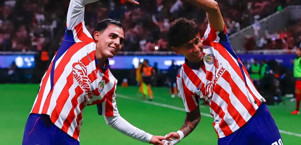 Chivas players celebrating after scoring a goal