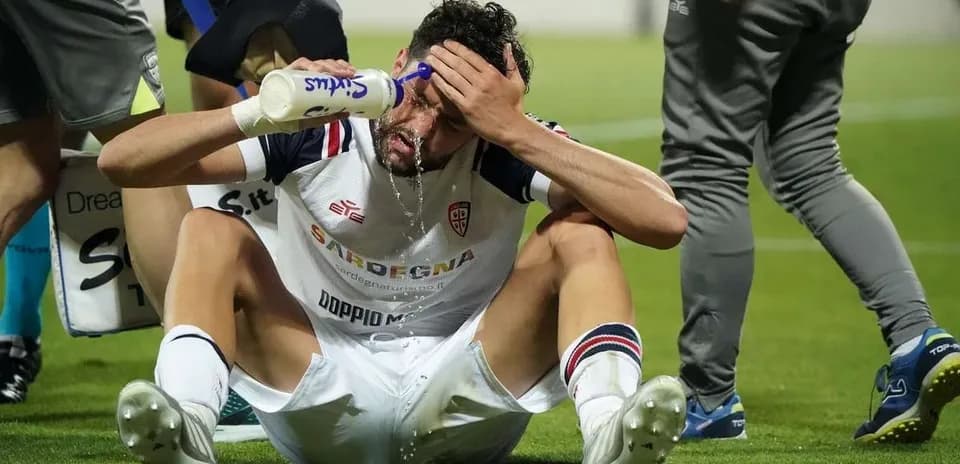 Player receiving hydration treatment on the field