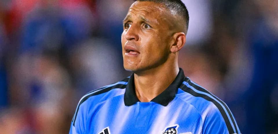 Goalkeeper in blue jersey during soccer match