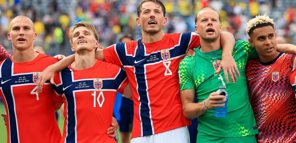 Norwegian football players celebrating together after match
