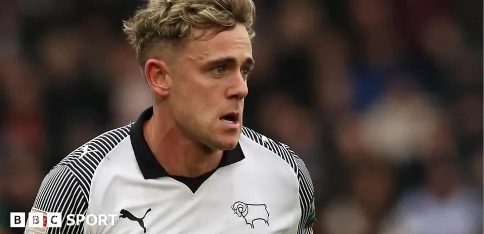 Player in Derby County kit during match action