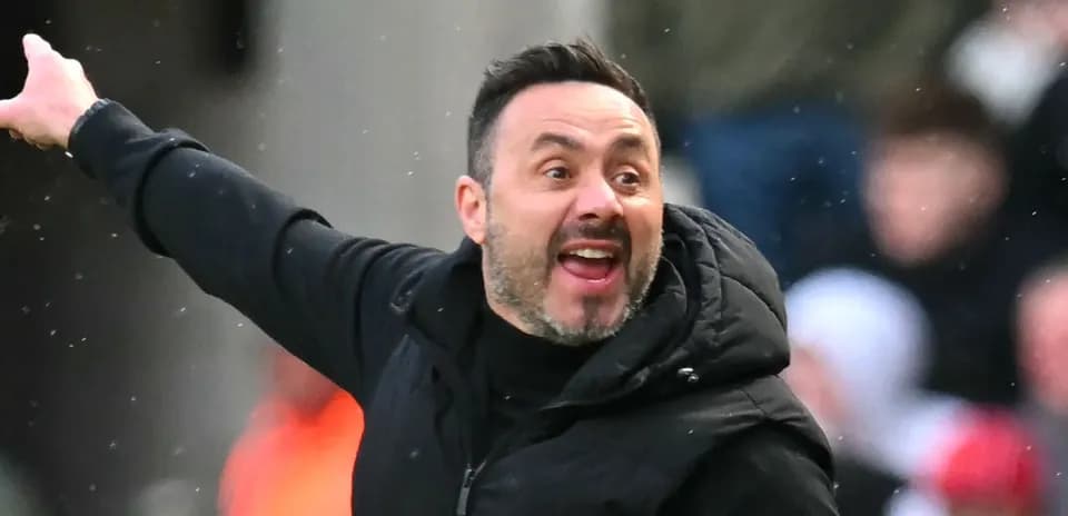 Coach gesturing during a match from the sidelines
