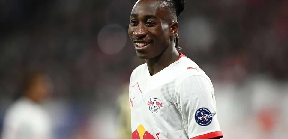 Player smiling while wearing RB Leipzig jersey