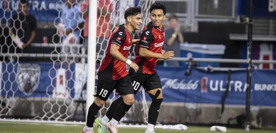 Players celebrating a goal during USL match