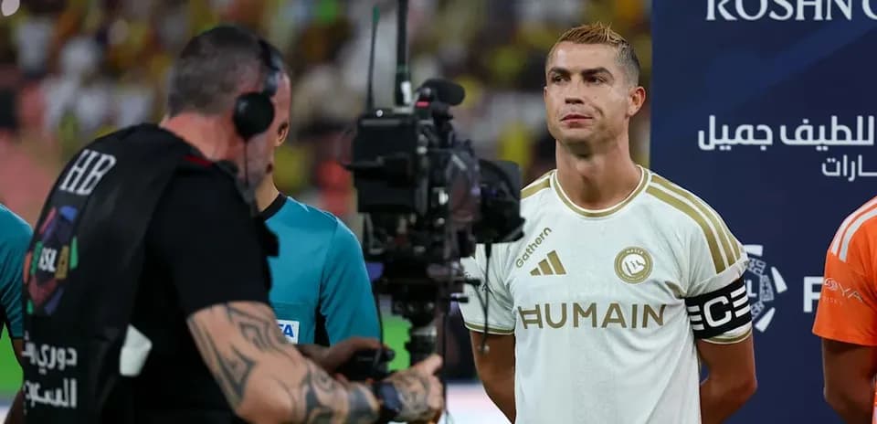 Cristiano Ronaldo standing with camera crew before match
