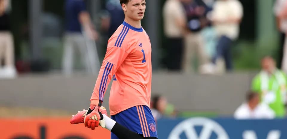 Goalkeeper stretching during training session