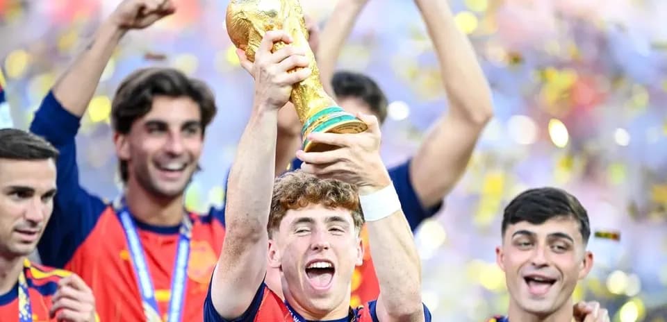 Player celebrating with FIFA World Cup trophy