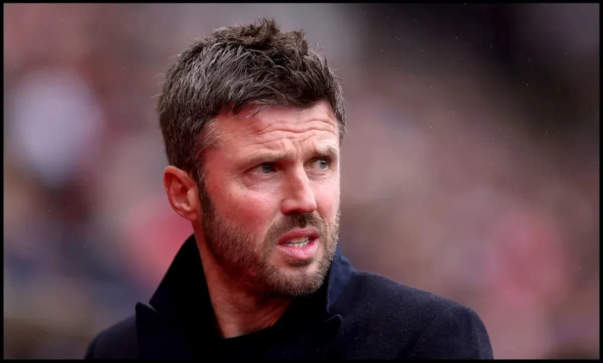 Man in black coat at a sports event