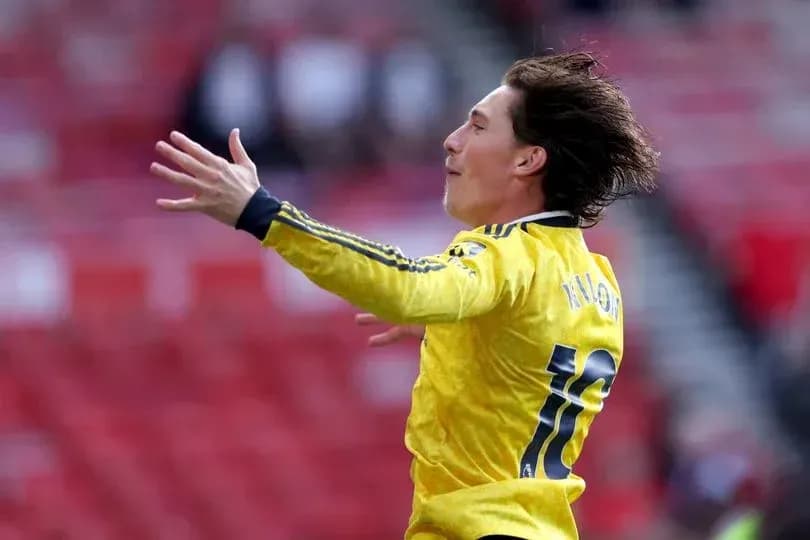 Player celebrating in yellow jersey on pitch