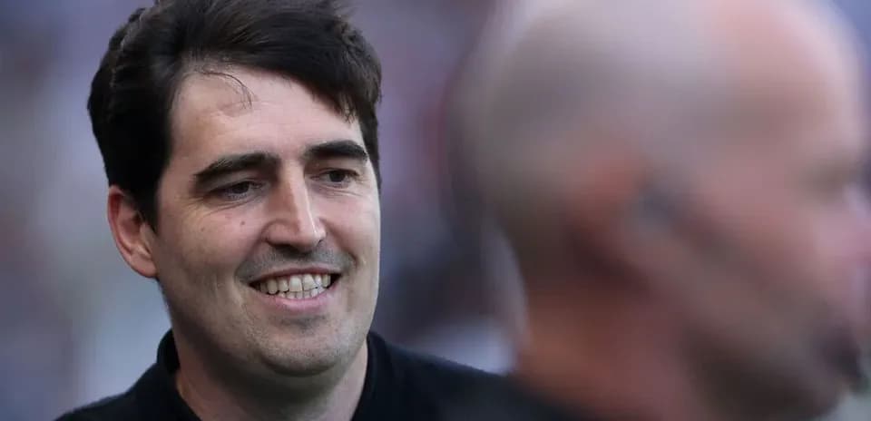 Man smiling during a sporting event interaction