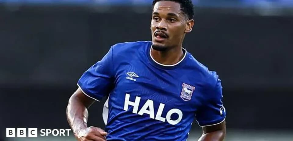 Player wearing blue jersey running on the field