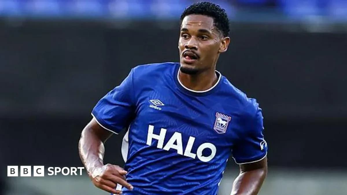Player wearing blue jersey running on the field