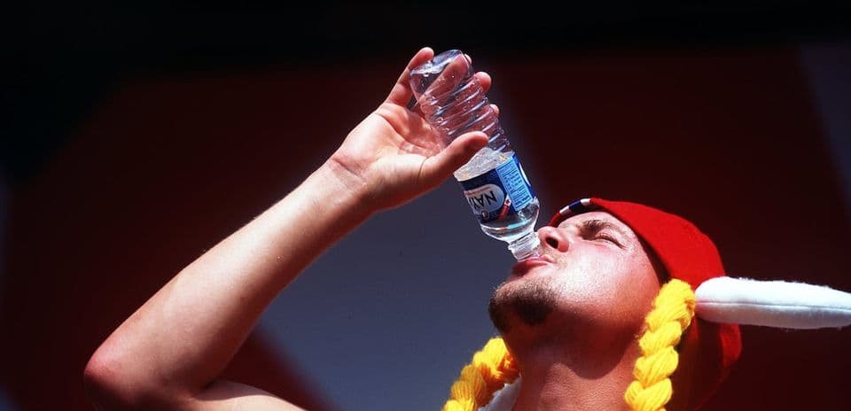 Person drinking water from a bottle