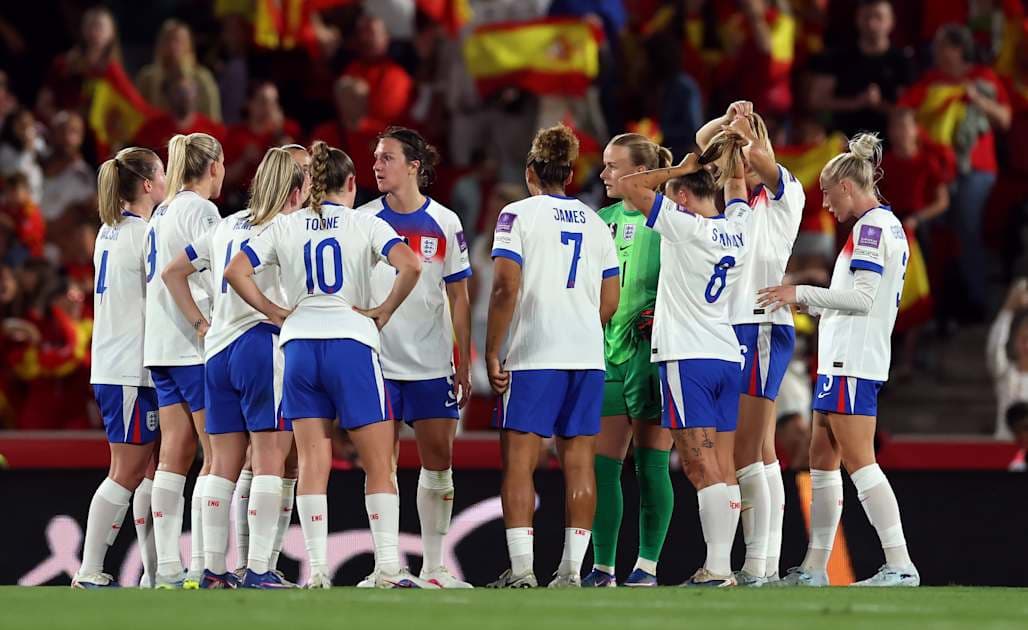 England women's team huddled during match