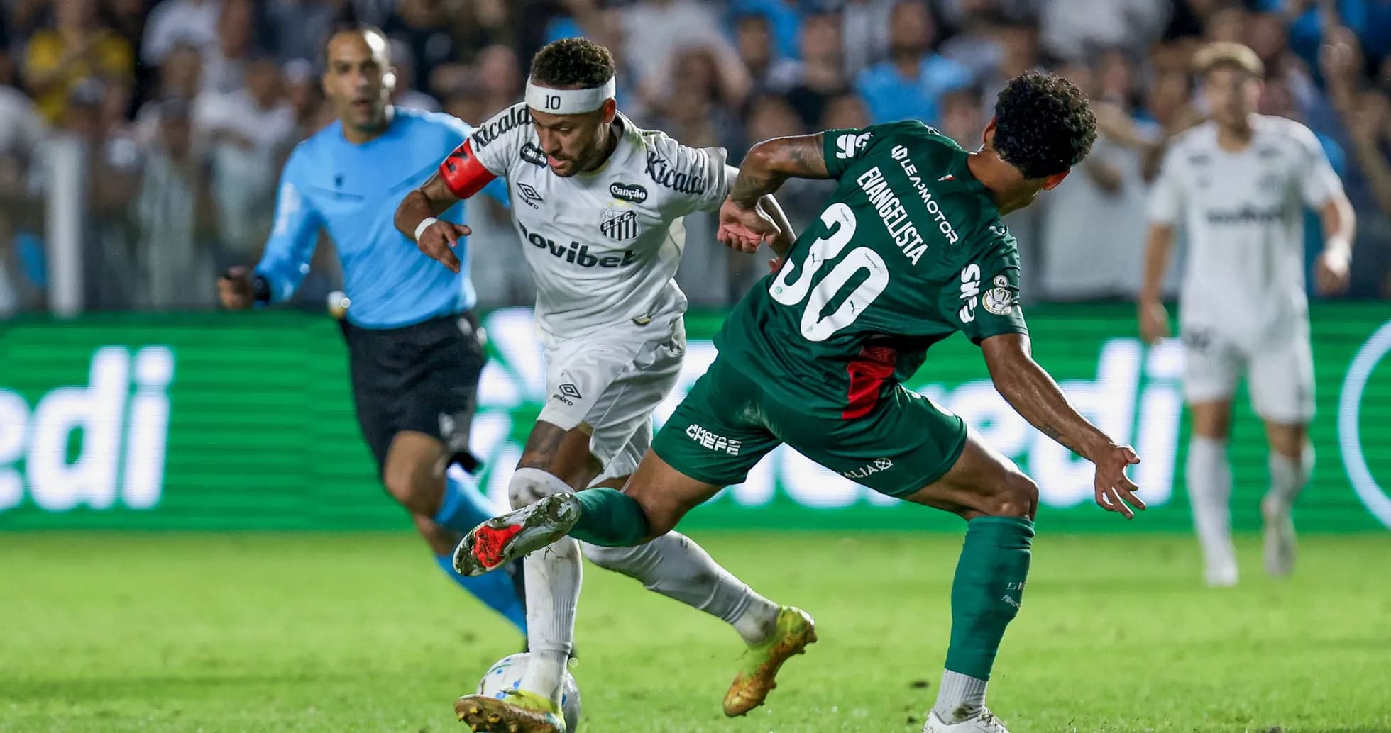 Player dribbling past opponent during football match
