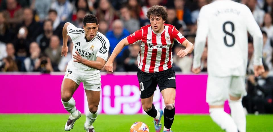 Real Madrid player chasing Athletic Club opponent