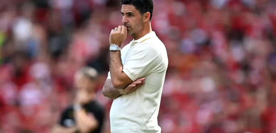 Coach observing match from the sidelines