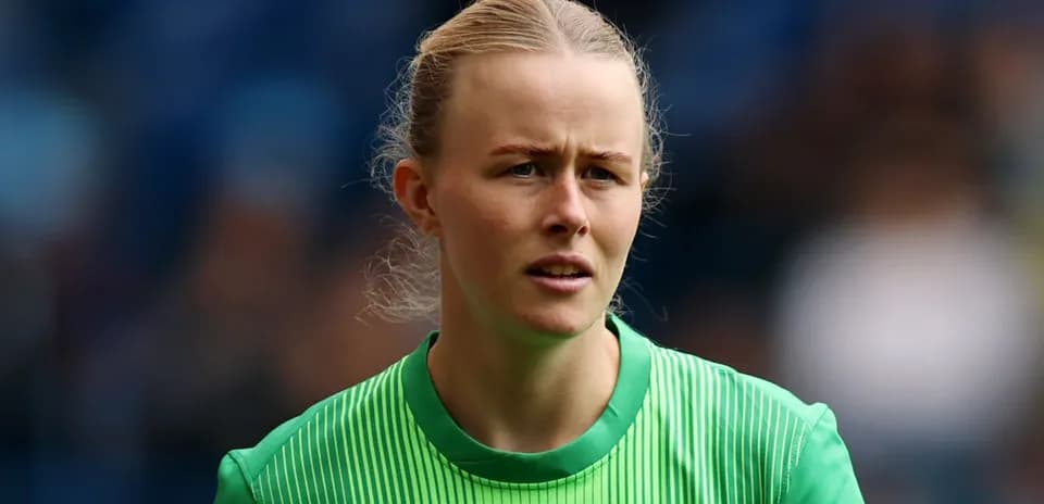 Goalkeeper in green jersey during match preparation