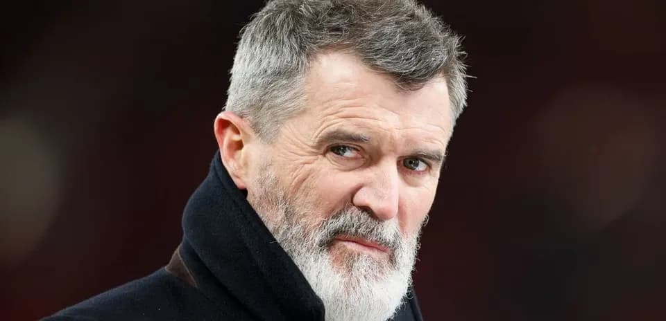 Man with gray beard looking intently at camera