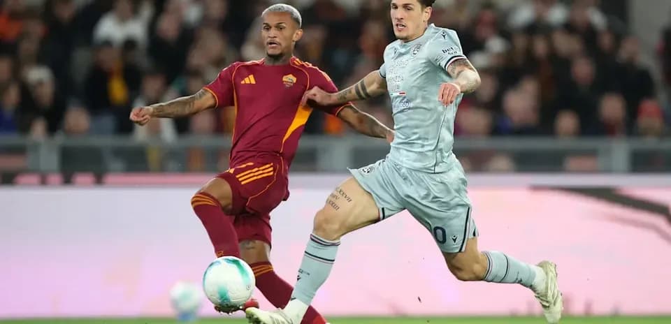 Two players competing for the ball during match