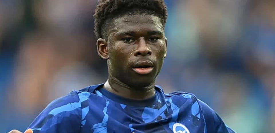 Player in blue jersey during football match