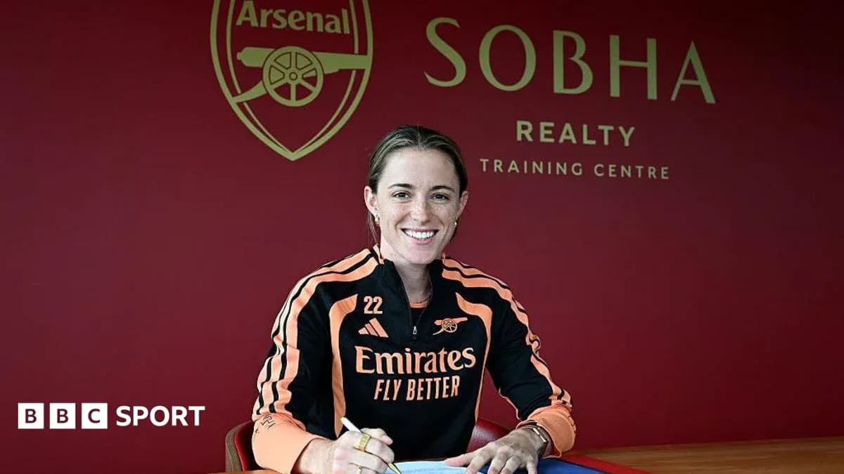 Player signing contract at Arsenal training centre